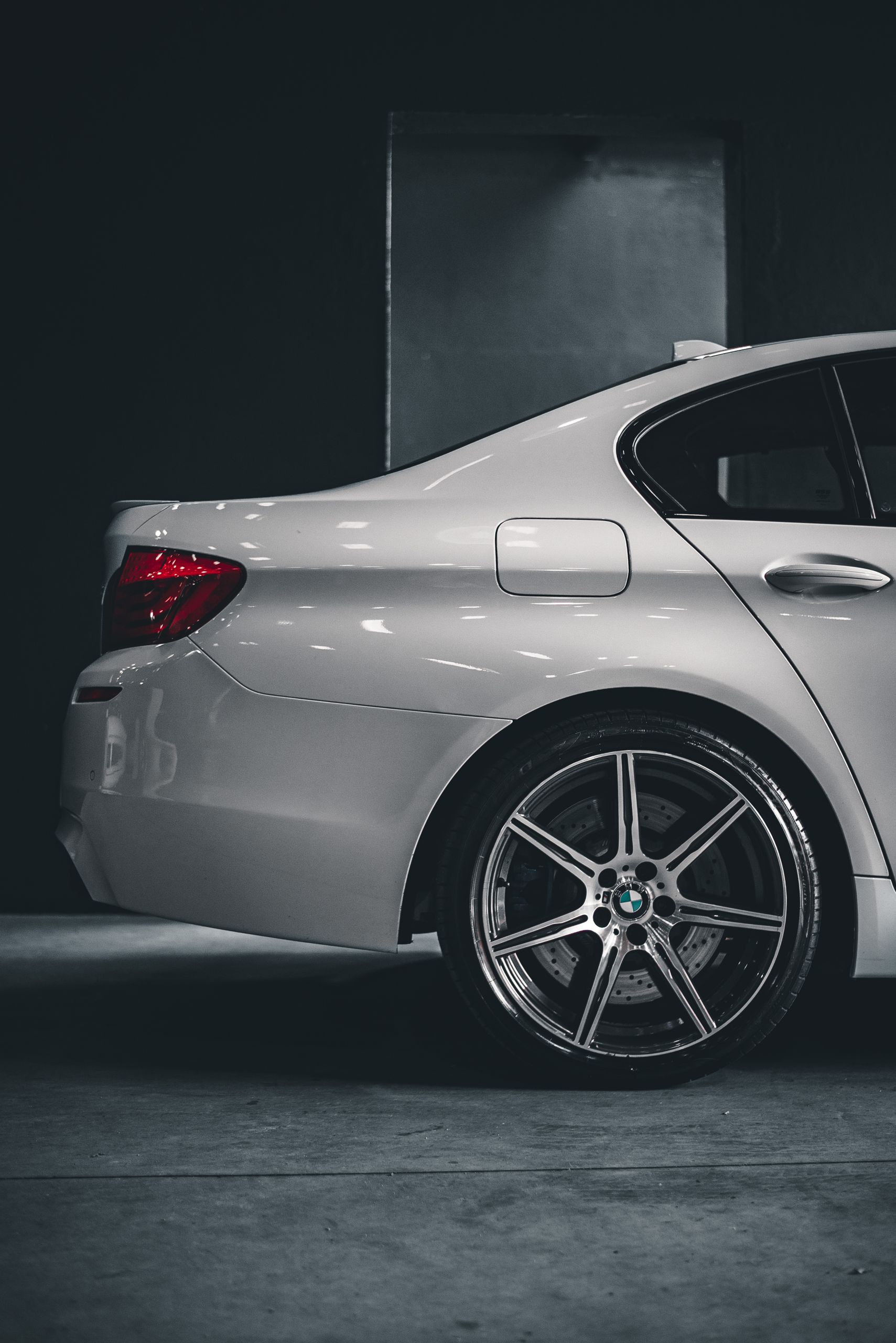 A stylish white BMW car showcased in a modern urban environment.
