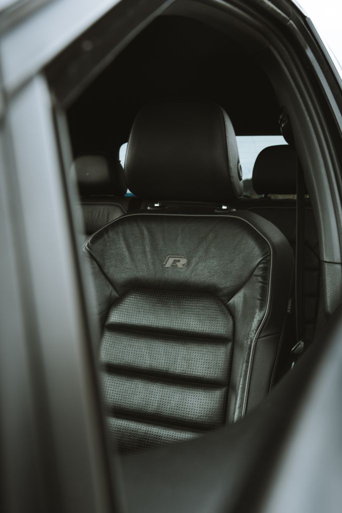 Black leather car seat showcasing luxury interior design and comfort.