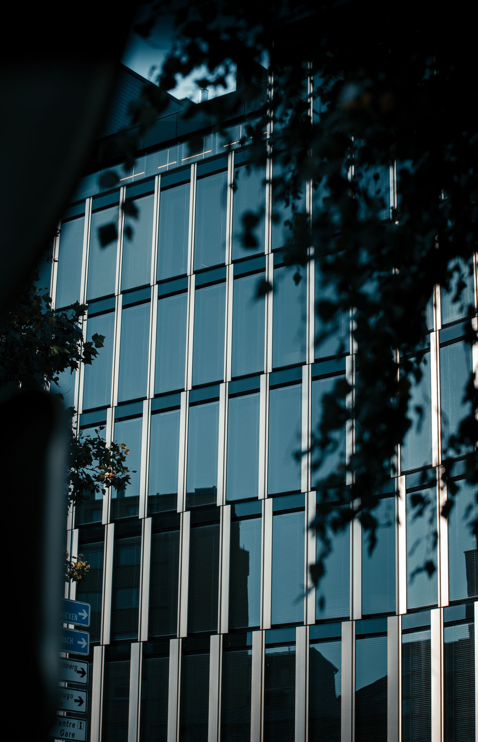 High-rise office building facade with glass windows in Luxembourg city.